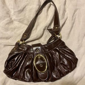 Small dark brown flap over purse